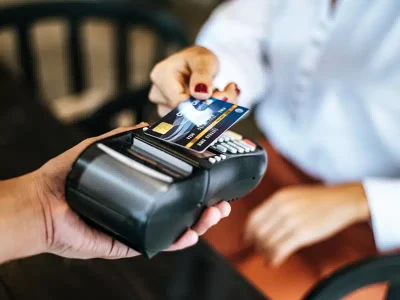 close-up-image-woman-paying-with-credit-card-cafe.jpg